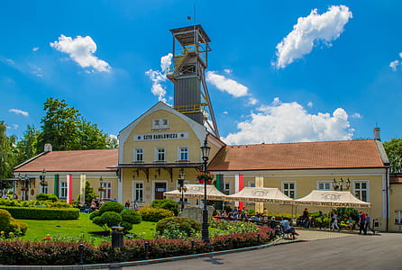 yellow painted building with tower thumbnail