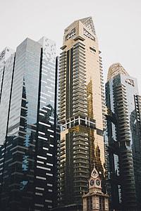 photo of gold-colored building during daytime thumbnail