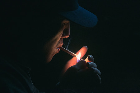 smoking man in black cap thumbnail