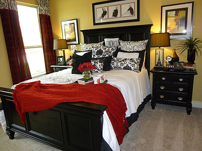 black wood-frame bed and nightstand with drawers thumbnail
