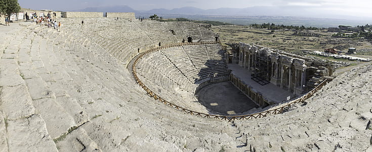 people standing in theater thumbnail