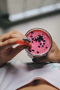 Girl holding blueberry yoghurt thumbnail