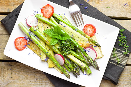 vegetable and fruit salad on white ceramic plate and silver-colored fork on table thumbnail