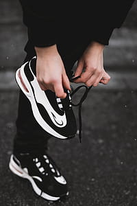 Person Tying Lace of Shoes thumbnail