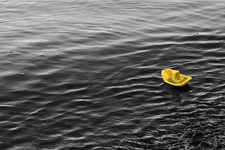 white boat floating on body of water thumbnail