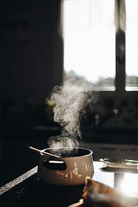 smoking white ceramic pot on black surface inside the room thumbnail