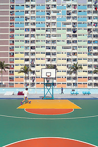 white and teal building near basketball court thumbnail