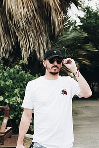 men's holding the temple of sunglasses thumbnail