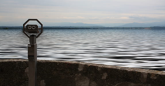 body of water under blue sky thumbnail