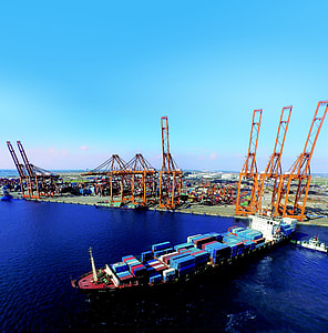 ship with container near dock at daytime thumbnail