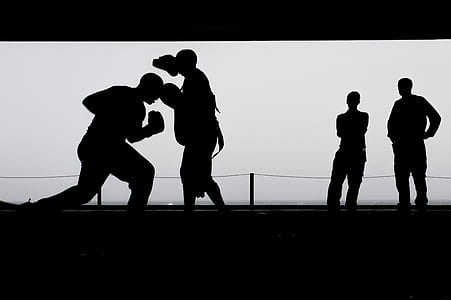 Silhouette Photo of a Men Fighting thumbnail