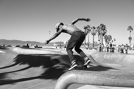grayscale photo of man playing skateboard thumbnail