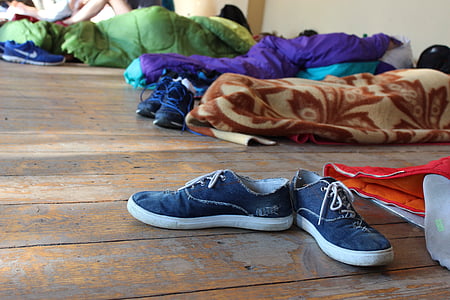 pair of blue low-top sneakers on floor thumbnail