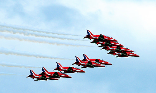 ten red aircrafts on sky thumbnail
