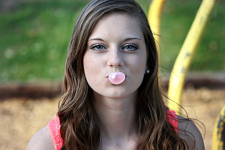 woman blowing bubblegum thumbnail