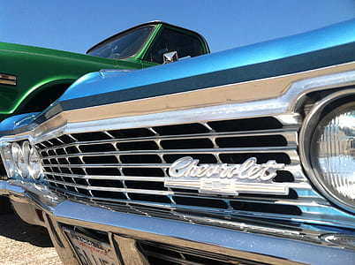 close up photography of classic blue Chevrolet car during daytime thumbnail