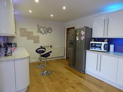 side-by-side door refrigerator beside with microwave oven thumbnail