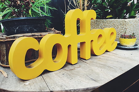 yellow coffee outdoor freestanding decor on brown wooden table thumbnail
