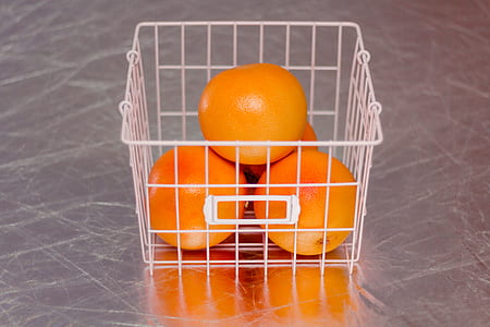 orange fruits on white basket thumbnail