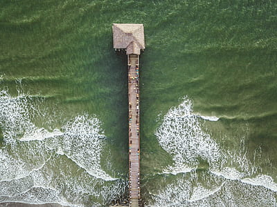 bird's-eye view of gray dock over body of wat6er thumbnail