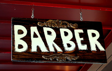 brown and white Barber signage thumbnail