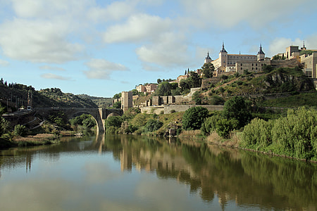 castle and bridge over body of water thumbnail