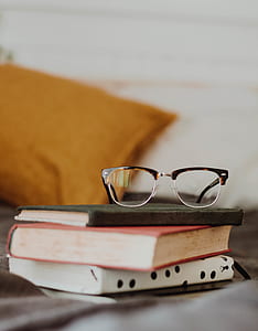 eyeglasses on three books thumbnail