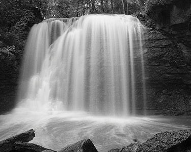 grayscale photography of waterfall thumbnail