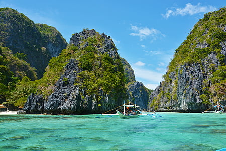 person boating on body of water during daytime thumbnail