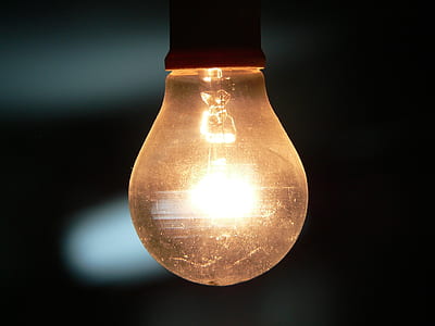 yellow light bulb against gray background thumbnail