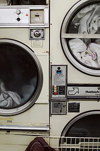 turned on white front-load clothes washer thumbnail