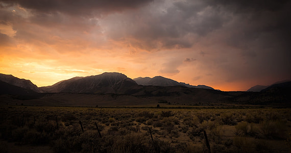 silhouette of mountains during golden hour thumbnail