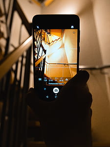 Person Holding Smartphone Showing Camera Application thumbnail