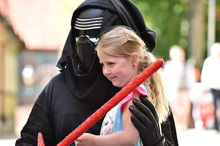 person wearing Kylo Ren costume holding girl thumbnail