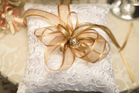 brown ribbon on white pillow thumbnail