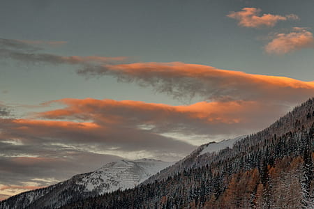 photo of mountain under white sky at daytime thumbnail