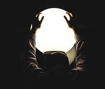 closeup photo of person's hand holding lighted ball thumbnail