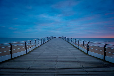 empty brown wooden dock during golden hour thumbnail