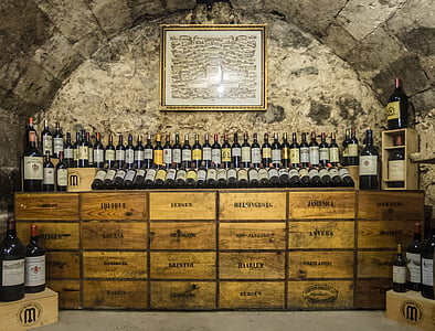 wine bottle lot on brown wooden dresser thumbnail