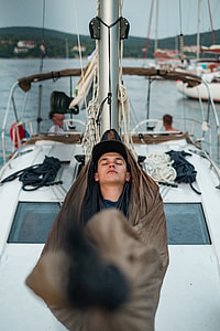 man lying on brown hammock thumbnail