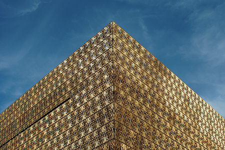 gold-colored building during blue sky thumbnail