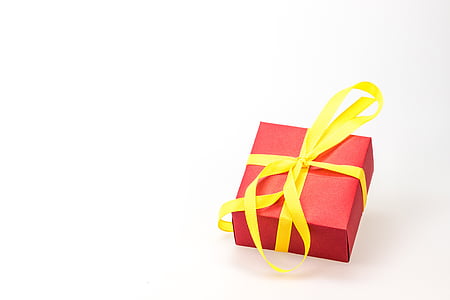 red and yellow present box on white surfac thumbnail
