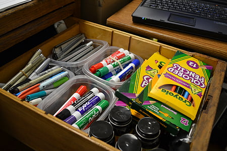 assorted school supplies in box thumbnail