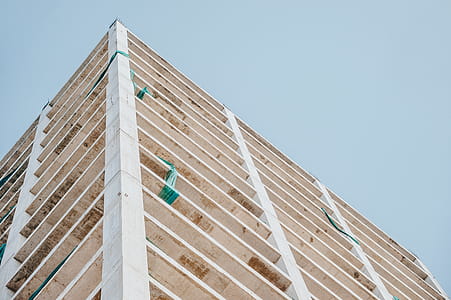 Low Angle Photography of Beige Concrete Building thumbnail