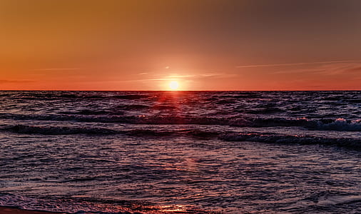 splashing waves and view of sunset thumbnail