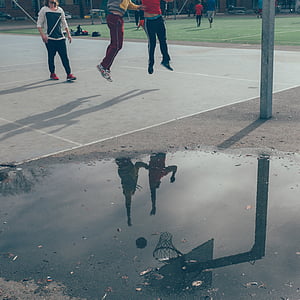 three person playing basketball thumbnail