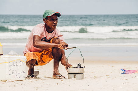 man sitting on gray sand thumbnail