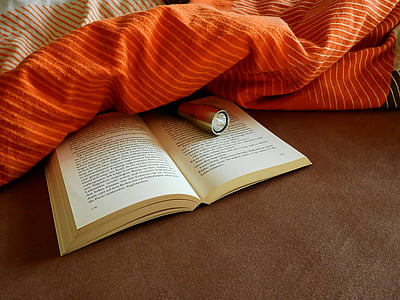 book under orange textile thumbnail