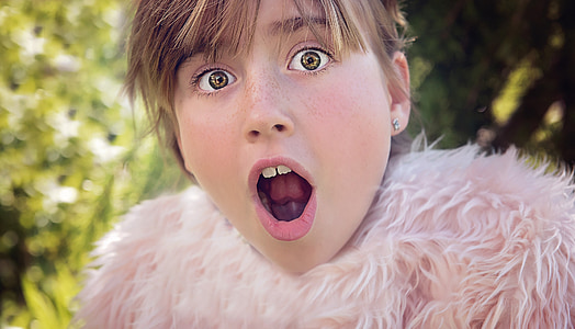 selective focus photo of girl open mouth wearing fur top thumbnail