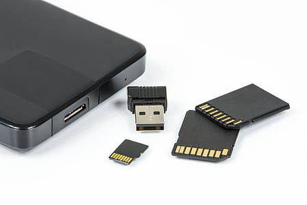 black USB dongle and SD card thumbnail